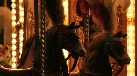 Horses in carousel merry-go-round children amusement Stock Footage