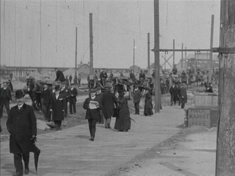 Horses pulling carts of sand moving along the promenade, United Kingdom, 1905 Stock Footage 132021956