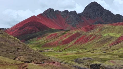Horses on trail Red Valley Peruvian Andes Vinicunca Rainbow Mountain trek Stock Footage 325714761