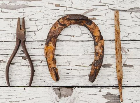 Horseshoe and tools Stock Photos