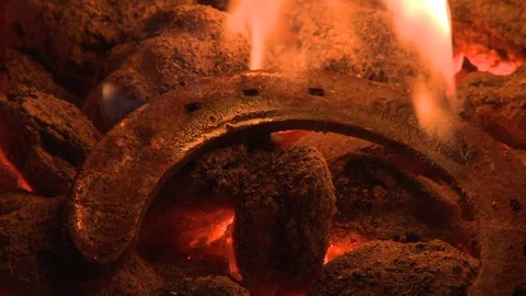 Horseshoe being being made in blacksmith shop Stock Footage 75240078