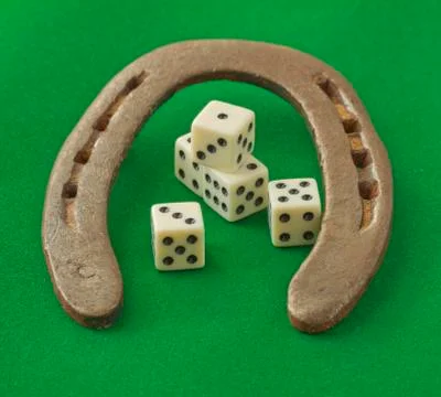 Horseshoe with dice Stock Photos