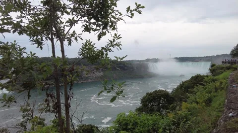 The Horseshoe Falls dropping into its deep pool behind a heavy column of mist Stock Footage 345996085