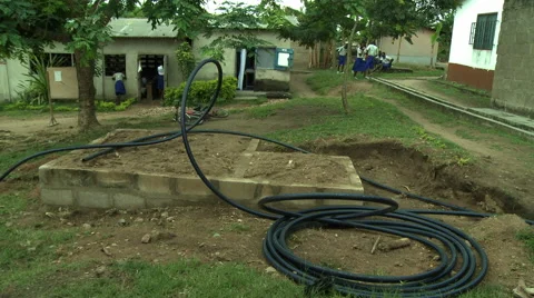 HOSE ON CONCRETE SLAB AT ADEISO SCHOOL Stock Footage 57981269