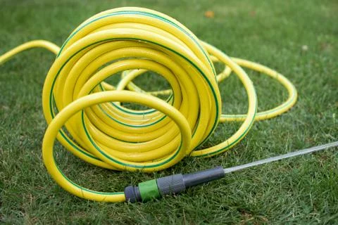 Hose pipe on a grass Stock Photos