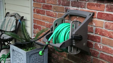 Hose Rolled up at House Stock Footage 71365943