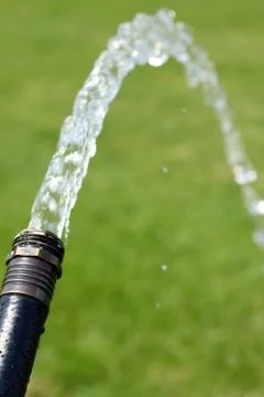 Hose spraying Stock Photos