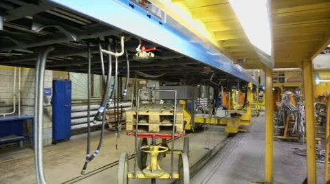Hoses and cylinder for chassis system of train wagon at workshop Stock Footage 32151909