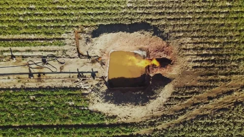 Hoses connected to compressor. Pumps and gas equipment. Amazing drone view of Stock Footage 219953122