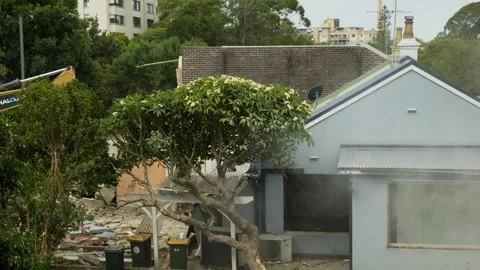 Hosing down a building about to be bulldozed 6K Stock Footage 325016186