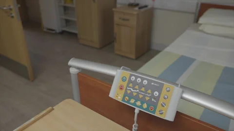 A hospital bed with a remote control on the bed Stock Footage 301622674