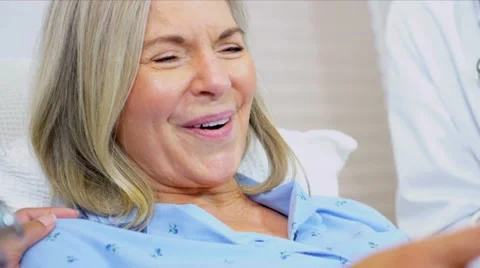 Hospital Consultant Discussing Patient Treatment Stock Footage