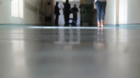 Hospital Corridor with walking feet Stock Footage