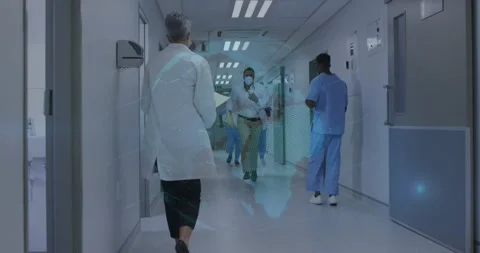 Hospital doc appearing from end running toward camera carrying yellow charts Stock Footage 330741356