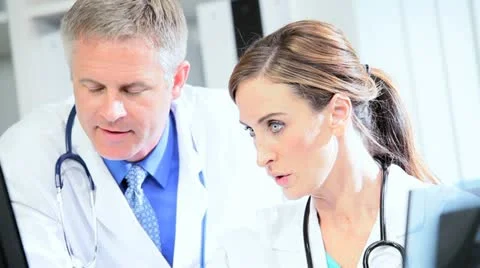 Hospital Doctors Using X-Ray with Computer Video stock 11374268