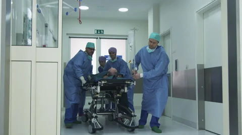Hospital Emergency Team Carrying Stretcher with Patient through Hospital Hall Stock Footage