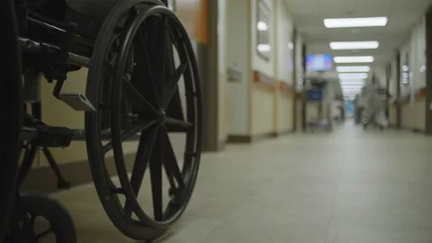 Hospital Hallway With Wheelchair Foreground Stock Footage