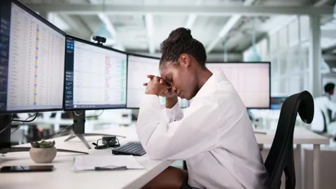 Hospital Nurse Frustrated Using Data Spreadsheet Stock Footage 312468525