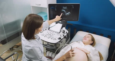 In the Hospital, Obstetrician Uses Transducer for Ultrasound, Sonogram Screening Stock Footage