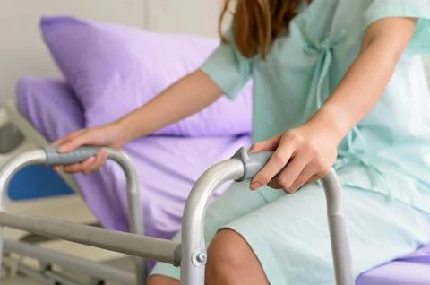 Hospital patient with a walking frame Stock Photos