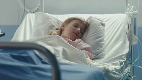 In Hospital Sick Girl Sleeps in Bed Mother Covers Her with Blanket Stock Footage