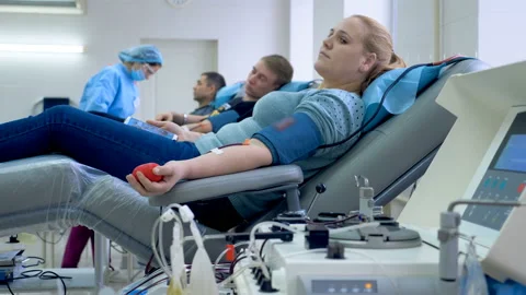 Hospital unit with people in the process of donating blood Stock Footage 104925646