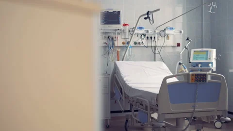 A hospital ward for one person with a bed and equipment Stock Footage