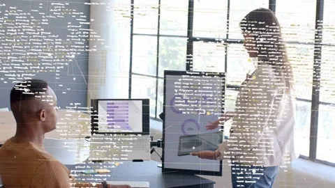Host angling tablet pointing charts in tech demo code overlay drifting over Stock Footage 337913036