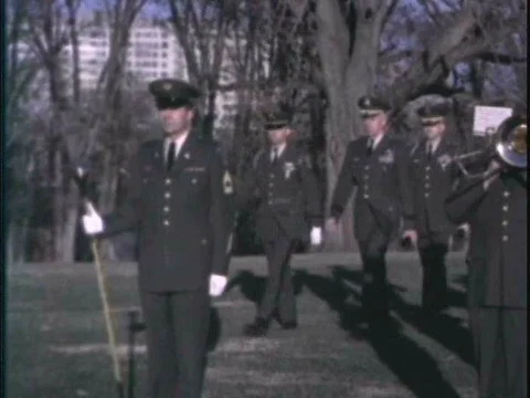 A host instructs the Honor Guard to present arms during a ceremony in the Vidéo 75273575