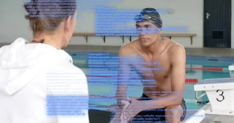 Host raising tablet asking question as swimmer on block wearing goggles Stock Footage 316983940