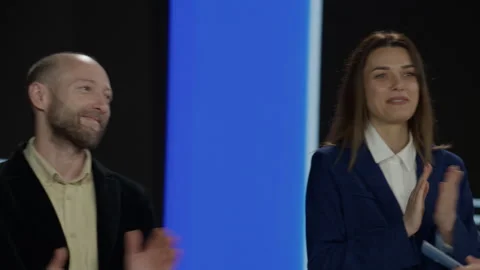 Host talking to contestants during recording of a fictional morning game show Stock Footage 249249887