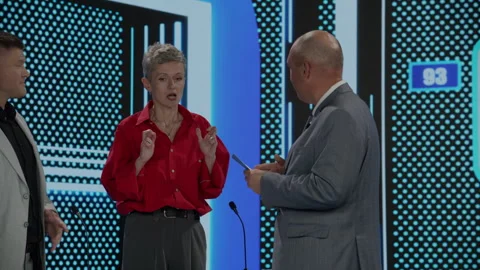 Host talking to contestants during recording of a fictional morning game show Stock Footage 249250262