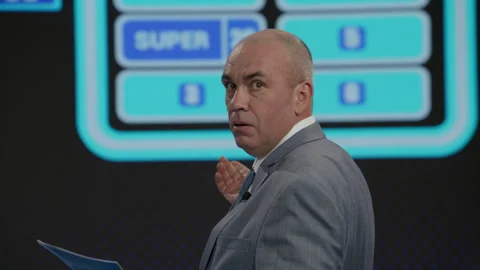 Host talking to contestants during recording of a fictional morning game show Stock Footage 259794805