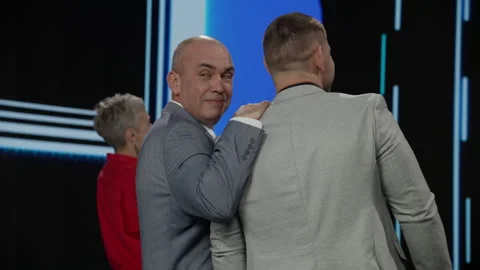 Host talking to contestants during recording of a fictional morning game show Stock Footage 259794919