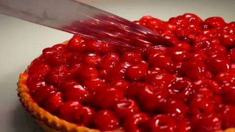 Hostess cuts a piece of raspberry jelly pie Stock Footage 105223886