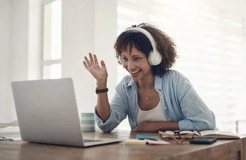 Hosting social events the lockdown way. an attractive young woman sitting at Stock Photos