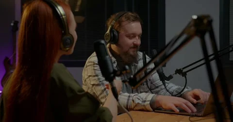 Hosts are having a conversation in the studio while recording a new episode. Stock Footage 264761068