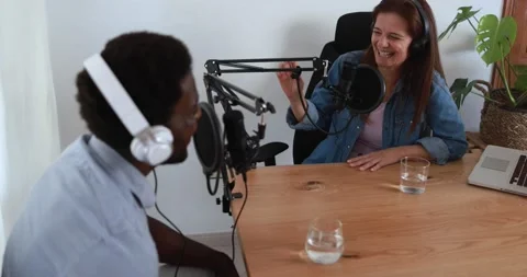 Hosts having podcast session together - Female speaker making an interview Stockbeeldmateriaal 161638248