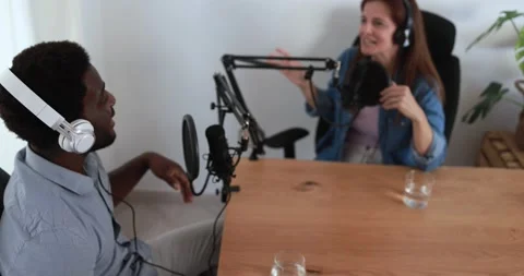 Hosts having podcast session together - Female speaker making an interview Stock Footage 161638520