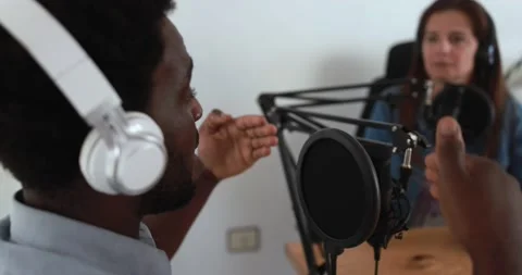 Hosts having podcast session together - African male speaker making an interview Видео 161638522