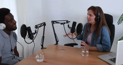Hosts having podcast session together - African male speaker making an interview Stock Footage 161638679
