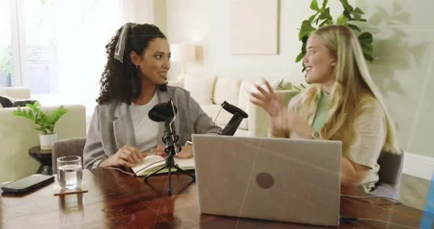 Hosts turning toward each other and activating chart, collaborating over laptop Stock Footage 320416260