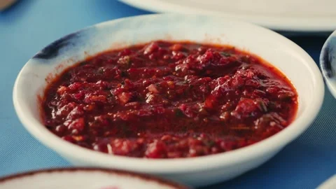 Hot adjika sauce served on the table to add piquancy to the meat. Stock Footage 327071706