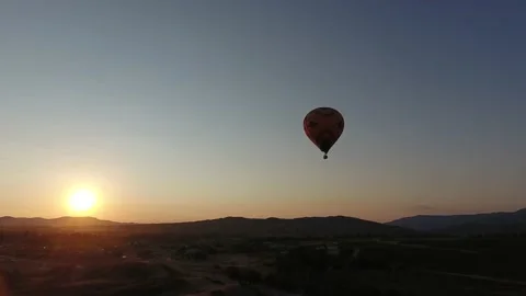 Hot air balloon during sunrise Stock Footage