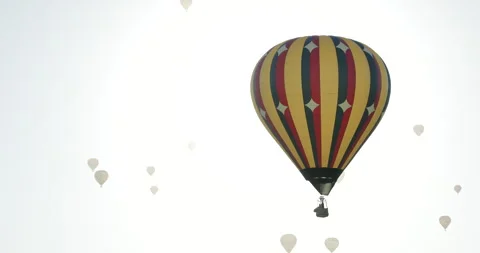 Hot Air Balloon Eclipse Effect with Sun Flare During Albuquerque Balloon Fi.. Stock Footage 335664845