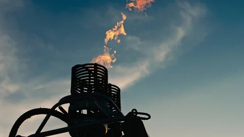 Hot air balloon. Fire bursts on sunset Stock Footage 86213835