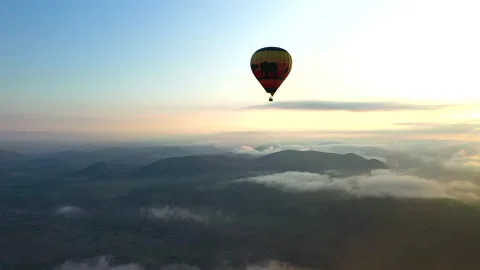 Hot air balloon floating high above the Pilanesberg Stock Footage 153226460