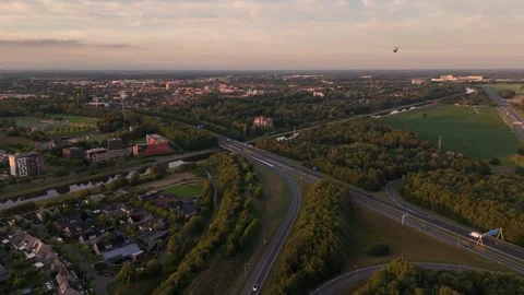 Hot air balloon floating over ede, netherlands at sunset Stock-Footage 314071519