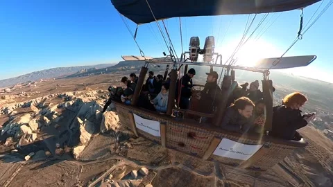 A hot air balloon gracefully soars, offering breathtaking views of Cappadocia. Stock Footage 265440353