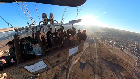 A hot air balloon gracefully soars, offering breathtaking views of Cappadocia. Video stock 265440478